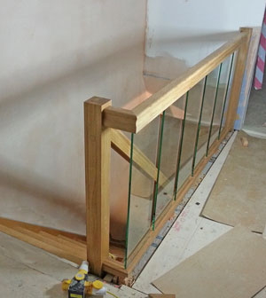 Glass panels along a landing banister