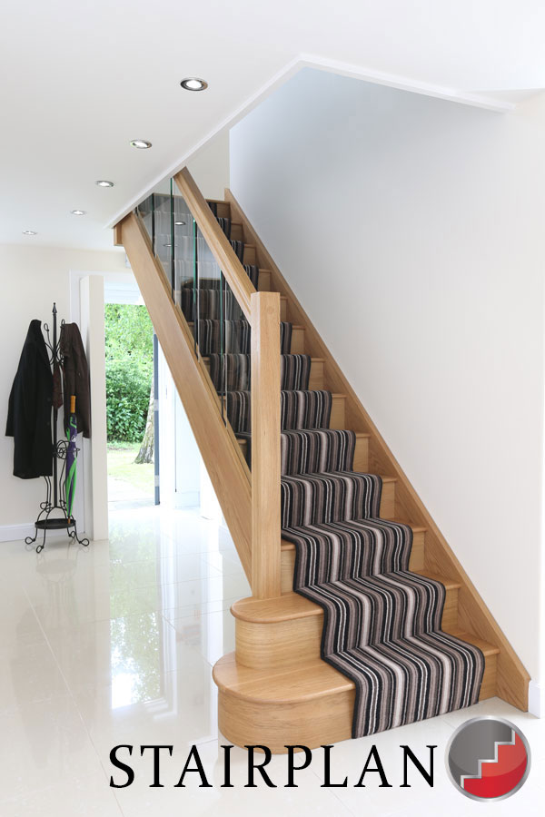 Houston Oak Staircase with glass balustrade striped carpet runner