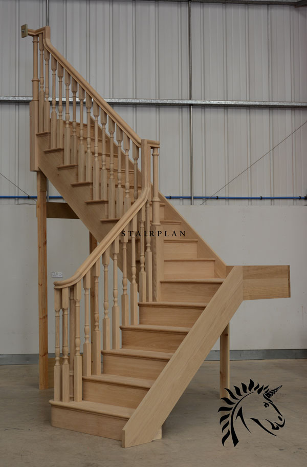 Oak cut string staircase with continuous handrails