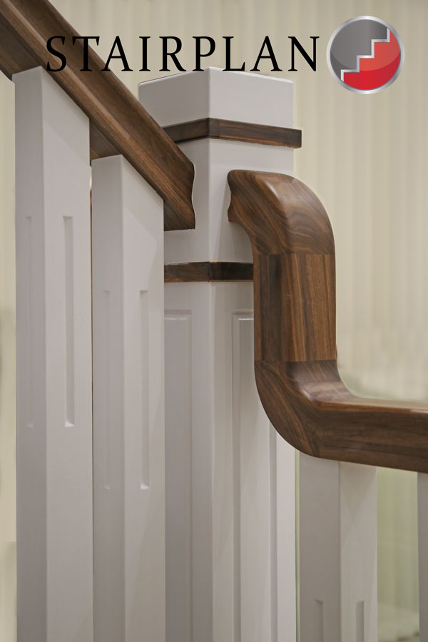 new england staircase with black walnut handrail