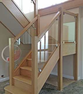 Oak staircase Vision glass balustrade with brackets