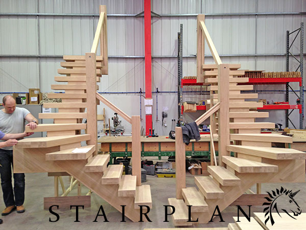 a pair of x-vision winder staircases in select oak