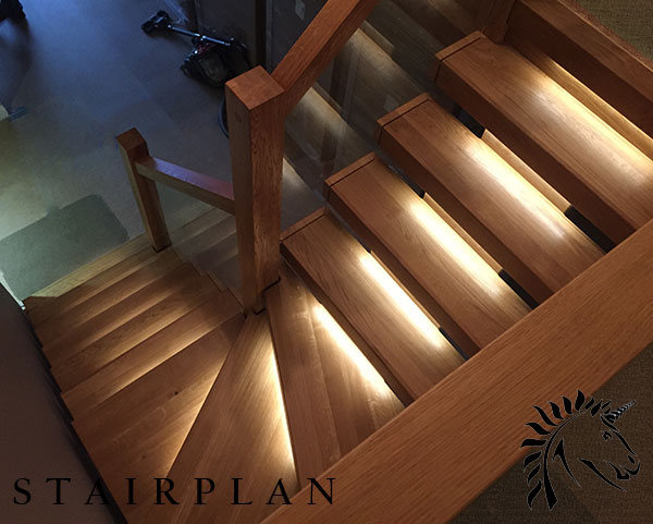oak x-vision staircase with led lights and tread recessed glass