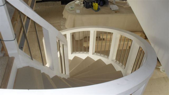looking down the curved staircase