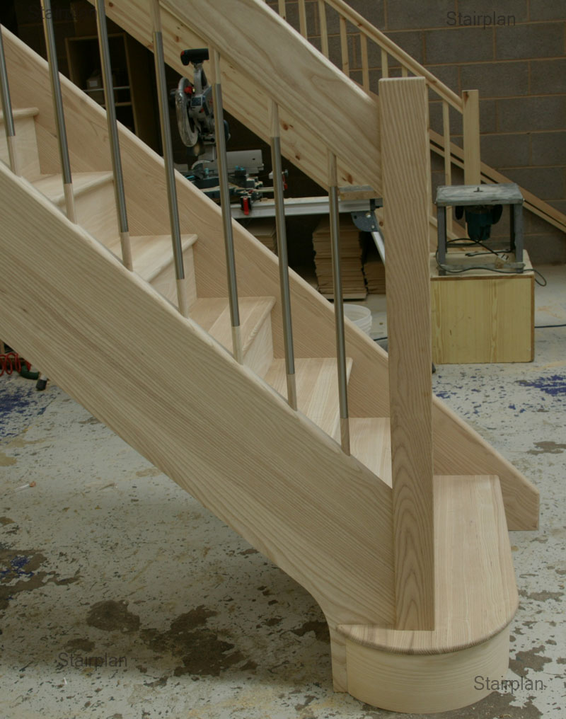Ash hardwood Staircase with a double curtail entry step