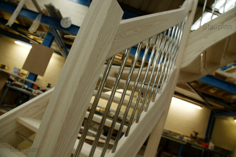 European style handrail in ash hardwood on a open riser staircase
