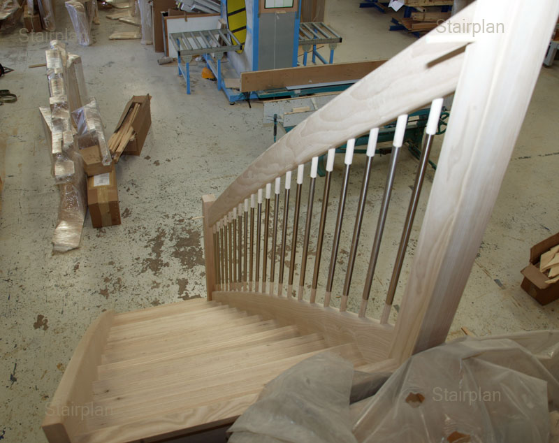 Looking down the staircase enhanced curved handrail