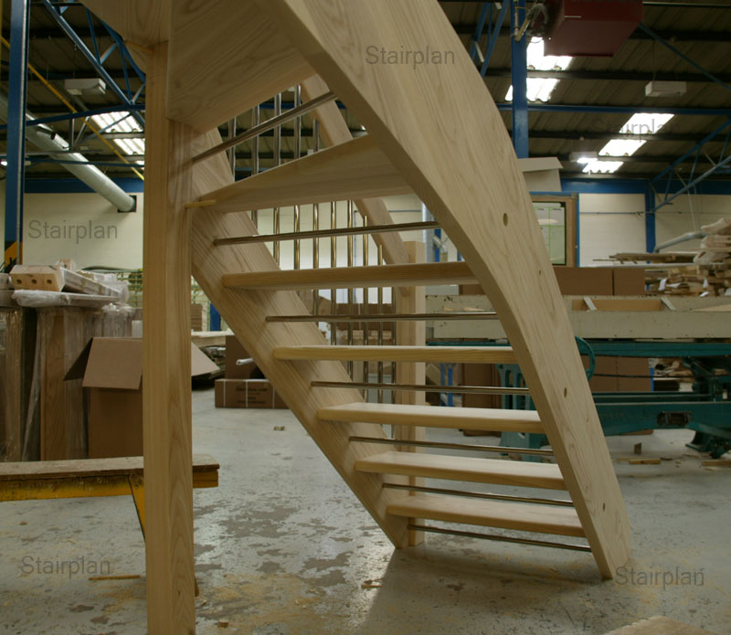 Underside of a openplan winder staircase riser bar for safety