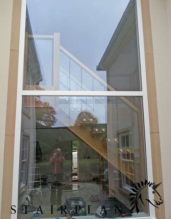 X-vision oak staircase installation in Woking