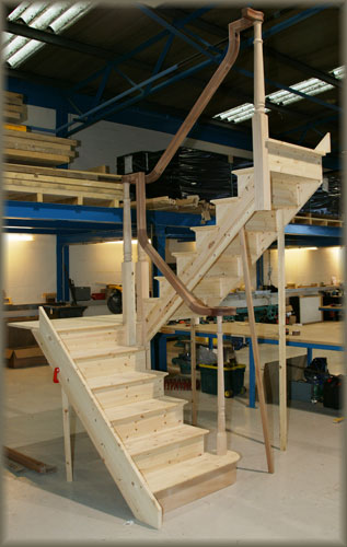 half landing staircase with continuous handrail