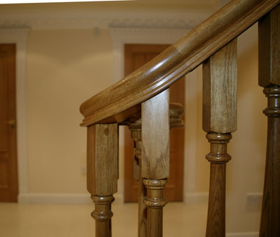 Ascending volute from the inside face of the staircase