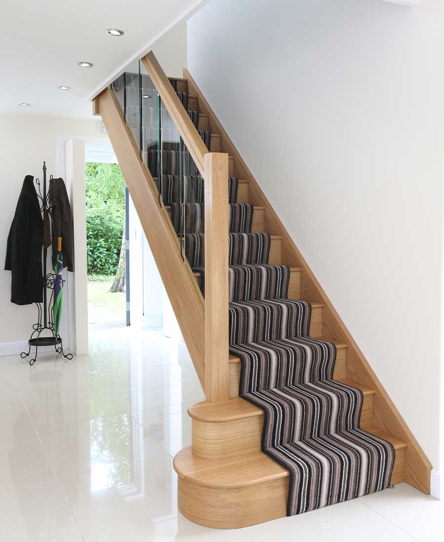 Houston oak staircase with embedded glass balustrade by Stairplan