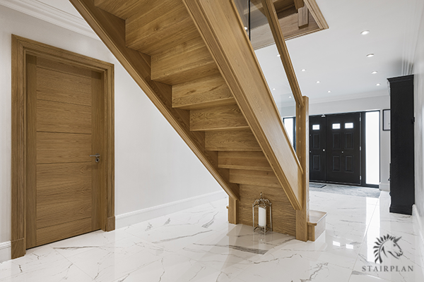 looking at the underside of the manhattan oak staircase with No wedge construction and concealed wiring