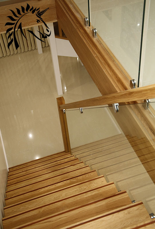 oak staircase with dark hardwood strip for cotrasting stair nosings
