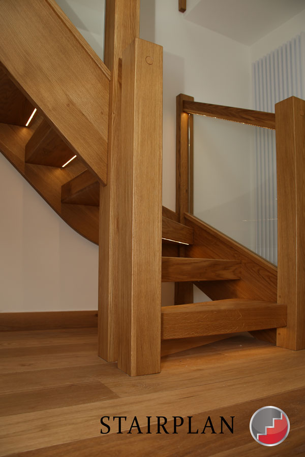 LED stair lighting under treads and inset into the handrail