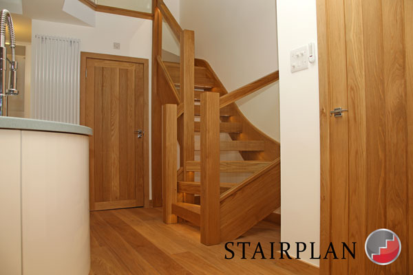 Townsend oak stair with glass balustrade and chunky oak sections
