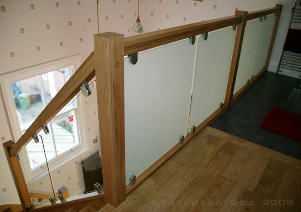 Vision glass balustrading with Oak Handrail