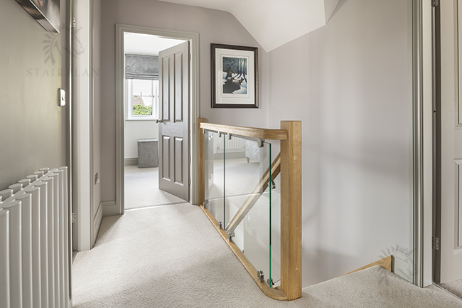 Oak and Vision glass landing balustrade with brackets location Muxton telford