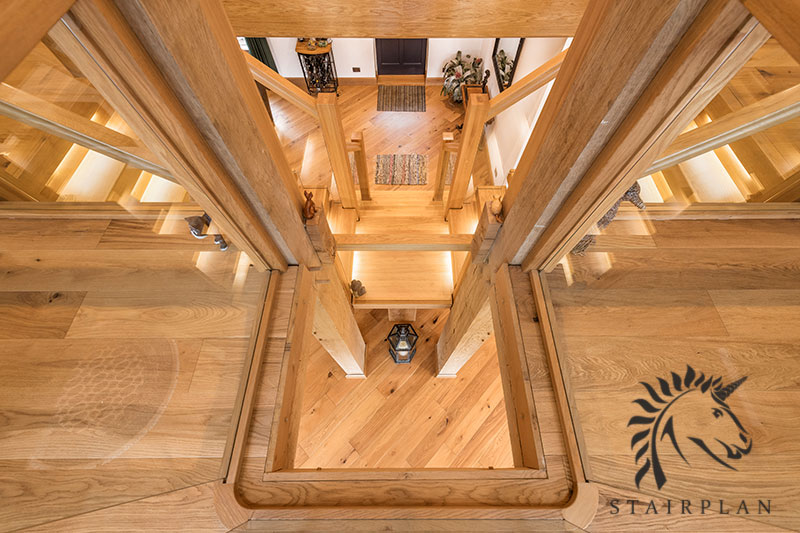 Oak x-vision staircase design in a barn conversion