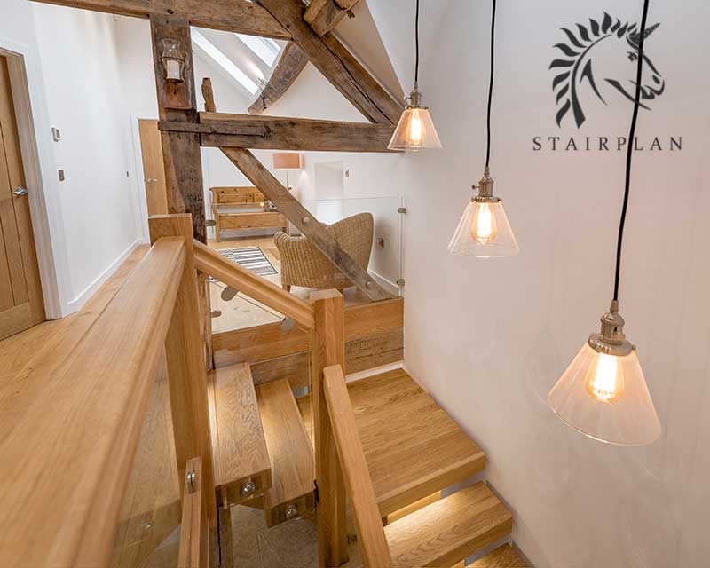 Oak x-vision staircase design in a barn conversion