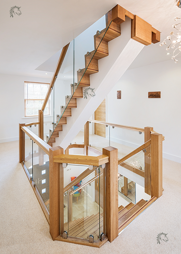 central staircase with glass balustrade